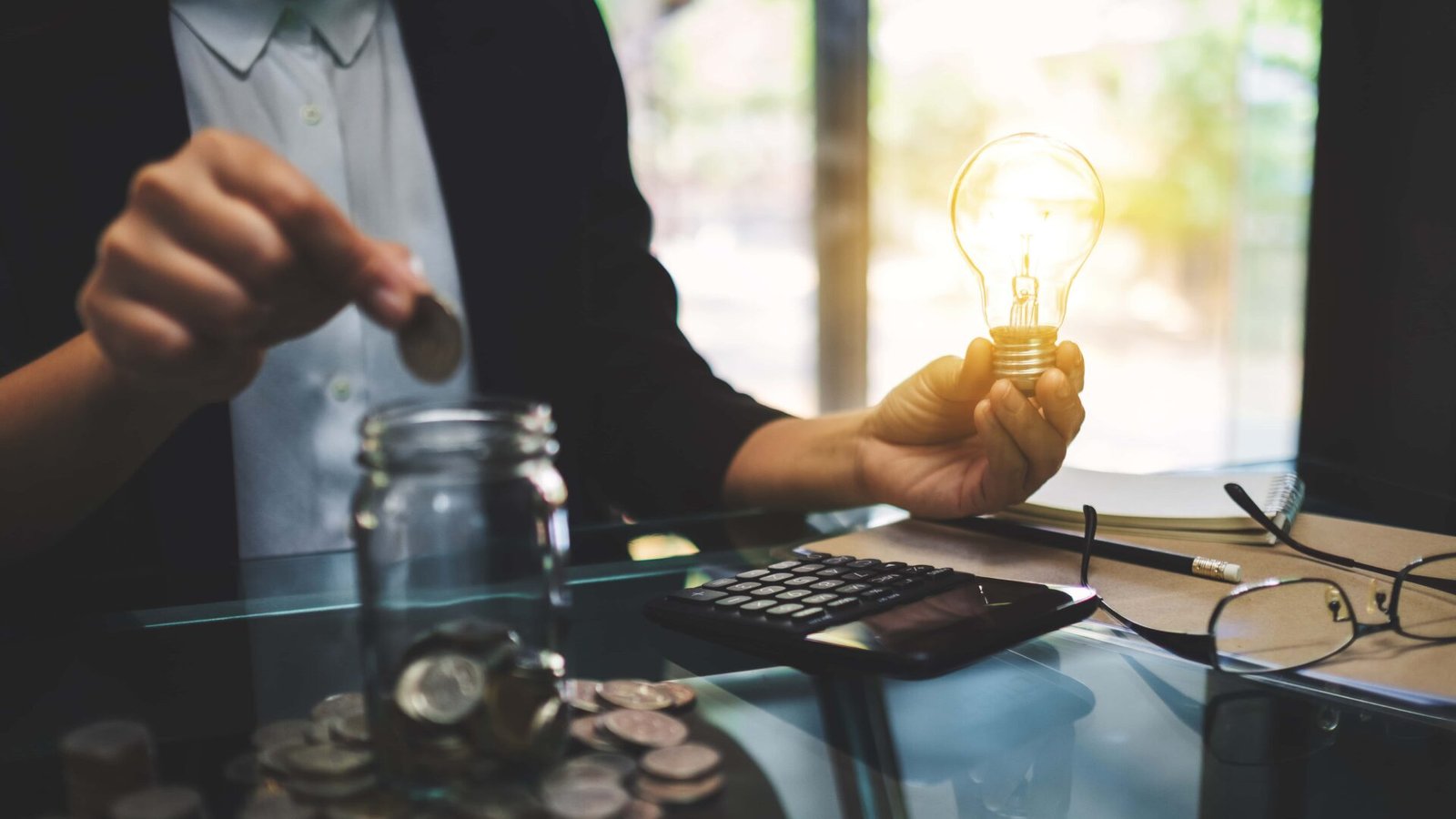 businesswoman-holding-a-light-bulb-while-putting-c-2026-01-06-09-04-38-utc (1)