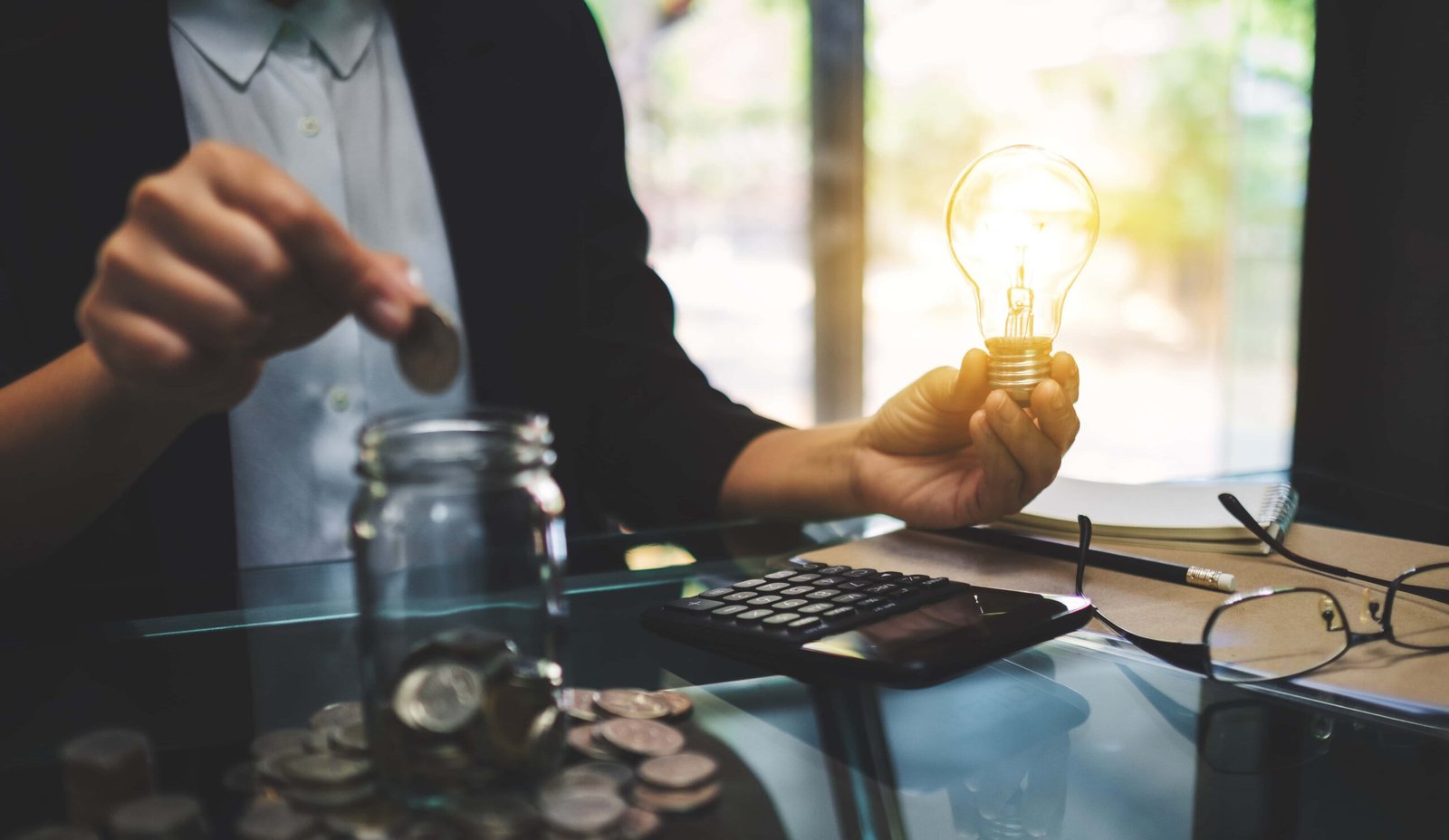 businesswoman-holding-a-light-bulb-while-putting-c-2026-01-06-09-04-38-utc (1)